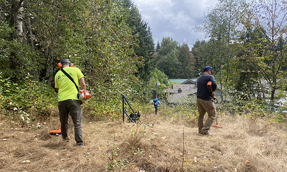 Team members were armed with trimmers, weed whackers, clippers, machetes, rakes, pitchforks to tackle the project.