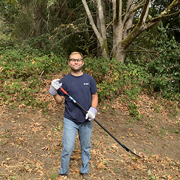 Cameron Duncan raking the hillside