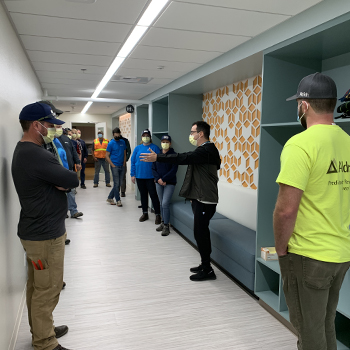 ABC staff lead A+ Team members on a tour of the newly remodeled space Aldrich had completed earlier in the year.